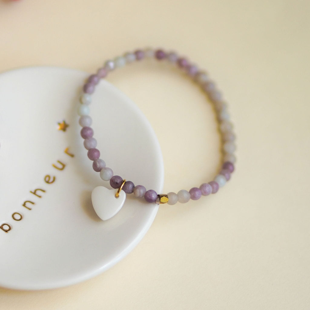 Bracelet perles rose clair avec pendant en porcelaine